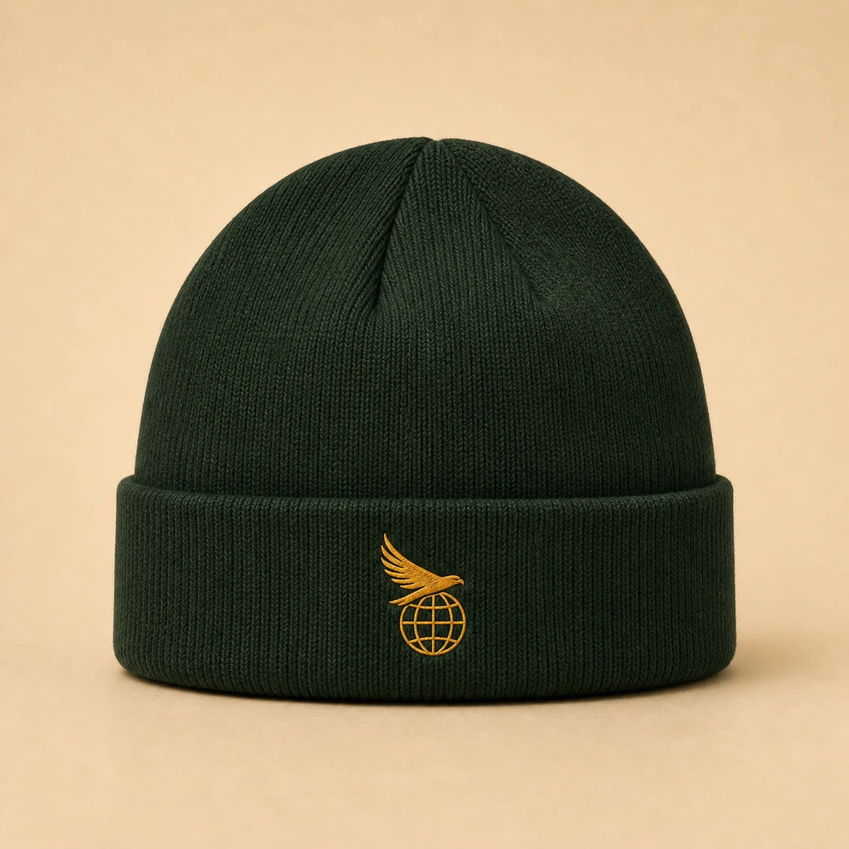 Spruce cuffed beanie with a small embroidered Hawk Nest globe and hawk mark